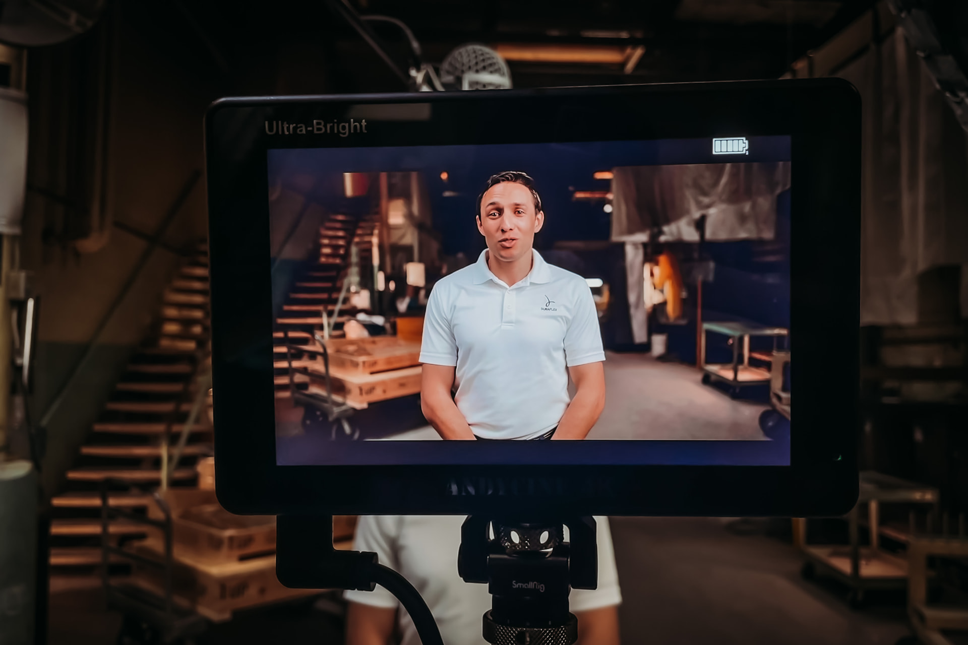 Client interview filmed in a warehouse